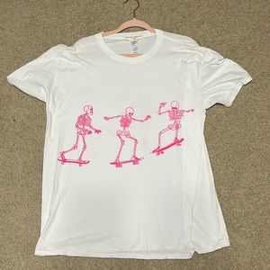 White shirt with hot pink skeletons, size medium